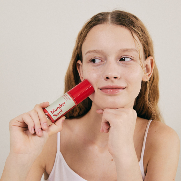 girl applying lip balm