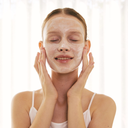 woman applying a face mask