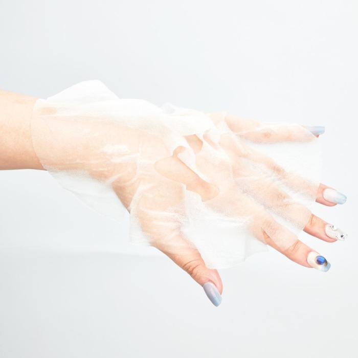 a female hand with blue nail polish