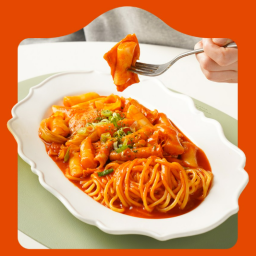 a plate of pasta and a hand holding a fork
