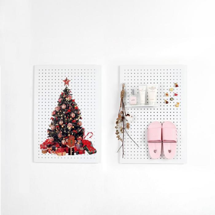 Wall-mounted pegboard set — one with a Christmas tree design and another used as functional storage with slippers and cosmetics.