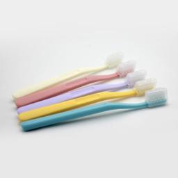 four toothbrushes in different colors
