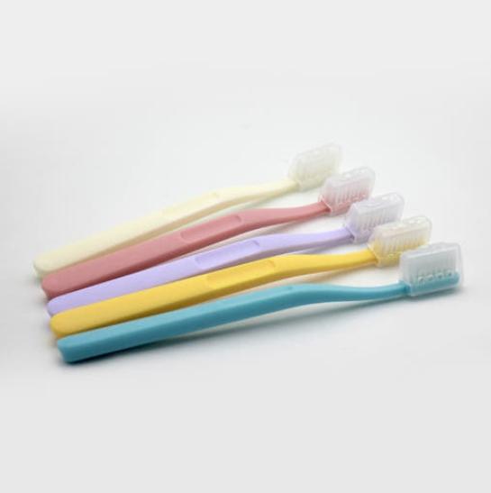 four toothbrushes in different colors