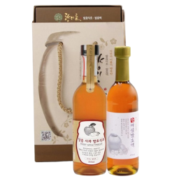 a bottle of wine and a box of sake
