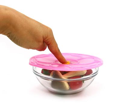 Reusable silicone lid for covering and storing food in bowls, containers, and dishes